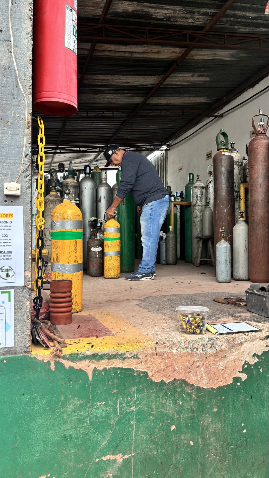 Person preparing oxygen cylinders for diving